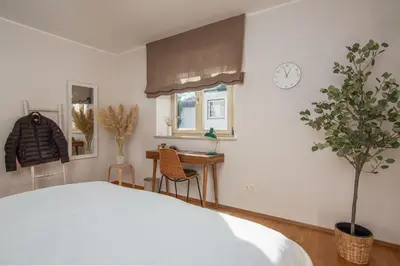Ein Bett oder Betten in einem Zimmer der Unterkunft MY STAY - Traumhafte Ferienwohnungen mit Bergblick und Sauna in Seenähe