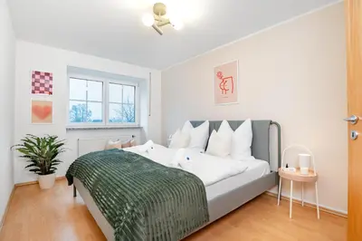 Ein Bett oder Betten in einem Zimmer der Unterkunft Therme Erding & Fly Apartment Berglern
