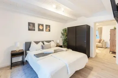 Ein Bett oder Betten in einem Zimmer der Unterkunft Dream Flat in Augsburg BBQ & Jacuzzi