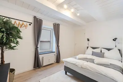Ein Bett oder Betten in einem Zimmer der Unterkunft Dream Flat in Augsburg BBQ & Jacuzzi