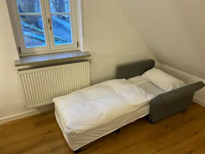 Ein Bett oder Betten in einem Zimmer der Unterkunft TheBlueInn