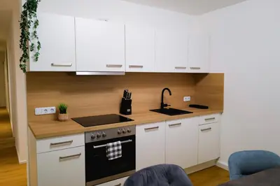 Küche/Küchenzeile in der Unterkunft Modern City Apartment Parking WiFi 6 Pax