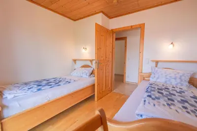 Ein Bett oder Betten in einem Zimmer der Unterkunft Ferienwohnungen Oberkollerhof