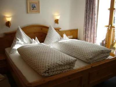 Ein Bett oder Betten in einem Zimmer der Unterkunft Gästehaus Sailer