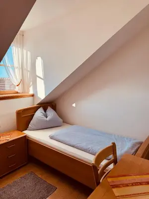 Ein Bett oder Betten in einem Zimmer der Unterkunft Gasthaus Stoiber