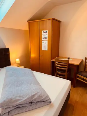 Ein Bett oder Betten in einem Zimmer der Unterkunft Gasthaus Stoiber