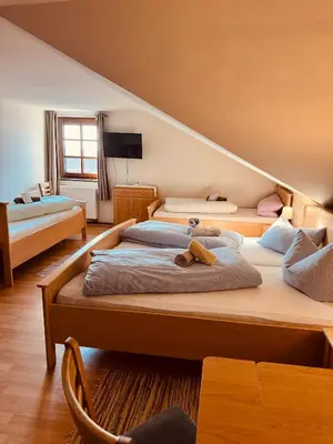 Ein Bett oder Betten in einem Zimmer der Unterkunft Gasthaus Stoiber