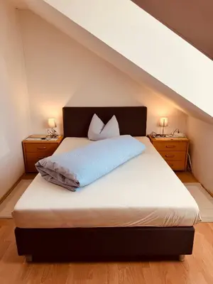 Ein Bett oder Betten in einem Zimmer der Unterkunft Gasthaus Stoiber