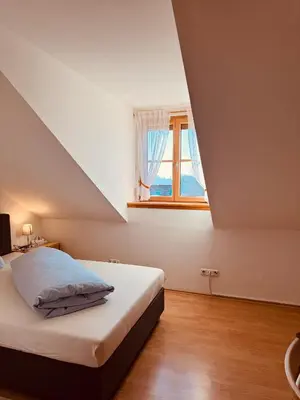 Ein Bett oder Betten in einem Zimmer der Unterkunft Gasthaus Stoiber
