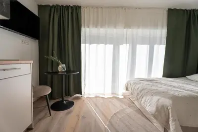 Ein Bett oder Betten in einem Zimmer der Unterkunft BLI One