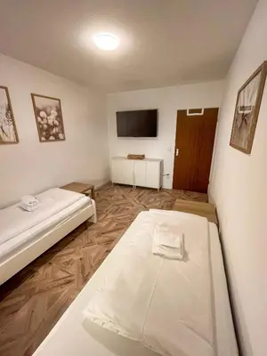 Ein Bett oder Betten in einem Zimmer der Unterkunft C4S - COME4STAY - Töging - InnStay - 3 Zi Apartment in Töging - 7Personen - Küche - Badezimmer - Balkon - SmartTV - WLAN