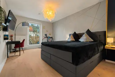 Ein Bett oder Betten in einem Zimmer der Unterkunft Wohlfühl- und Workout Appartement mit Balkon