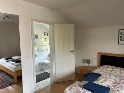 Ein Bett oder Betten in einem Zimmer der Unterkunft Gemütliche Wohnung in Baldham bei München
