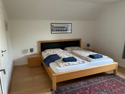 Ein Bett oder Betten in einem Zimmer der Unterkunft Gemütliche Wohnung in Baldham bei München