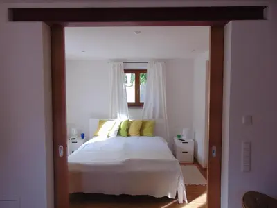 Ein Bett oder Betten in einem Zimmer der Unterkunft Ferienwohnung Kiental