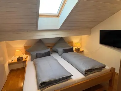 Ein Bett oder Betten in einem Zimmer der Unterkunft Zugspitze 6 mit SAUNA in Farchant bei GarmischPartenkirchen