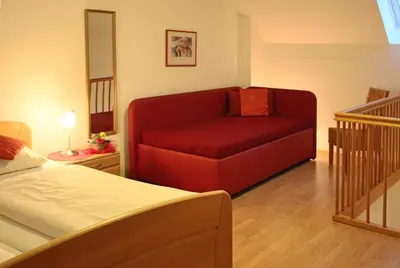 Ein Bett oder Betten in einem Zimmer der Unterkunft Döllelhof Erding