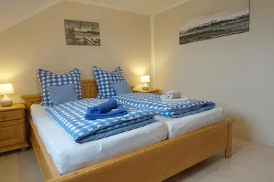 Ein Bett oder Betten in einem Zimmer der Unterkunft Ferienwohnung Stumbaum