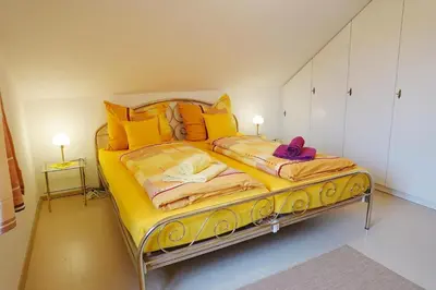 Ein Bett oder Betten in einem Zimmer der Unterkunft Ferienwohnung Stumbaum