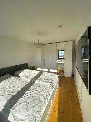 Ein Bett oder Betten in einem Zimmer der Unterkunft Gemütliche Ferienwohnung Zugspitzblick in Oberau