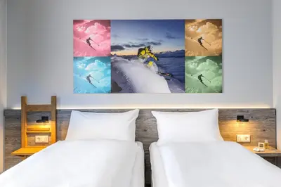Ein Bett oder Betten in einem Zimmer der Unterkunft Felix Hotel Kaufbeuren