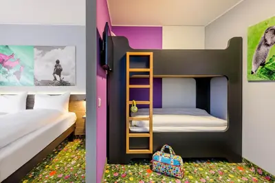 Ein Bett oder Betten in einem Zimmer der Unterkunft Felix Hotel Kaufbeuren
