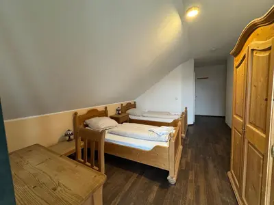 Ein Bett oder Betten in einem Zimmer der Unterkunft Weissenfelder Guest House & Restaurant