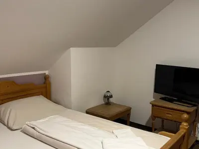 Ein Bett oder Betten in einem Zimmer der Unterkunft Weissenfelder Guest House & Restaurant
