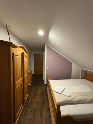 Ein Bett oder Betten in einem Zimmer der Unterkunft Weissenfelder Guest House & Restaurant