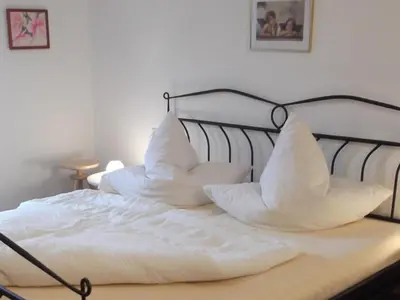 Ein Bett oder Betten in einem Zimmer der Unterkunft Apartment Apartment mit Königscard für 4 Personen by Interhome