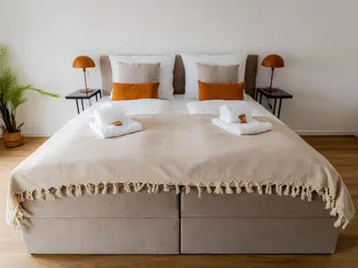 Ein Bett oder Betten in einem Zimmer der Unterkunft Apartment Highlight - Come4Stay - Mühldorf Stadtblick by Interhome