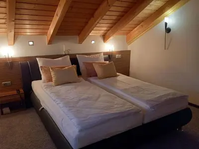 Ein Bett oder Betten in einem Zimmer der Unterkunft Apartment Maisonette Deluxe by FeWo-Amperland by Interhome