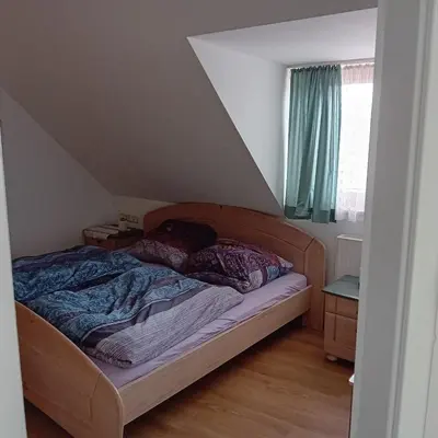 Ein Bett oder Betten in einem Zimmer der Unterkunft Ferienwohnung Dietz