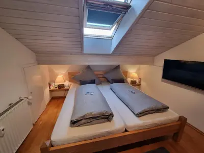 Ein Bett oder Betten in einem Zimmer der Unterkunft Zugspitze 67 mit SAUNA in Farchant bei Garmisch-Partenkirchen