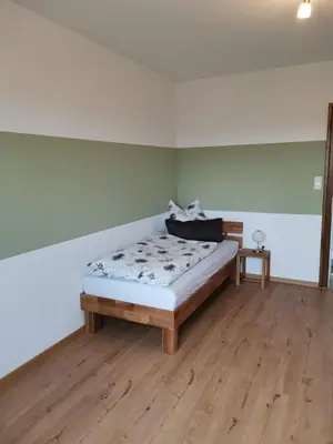 Ein Bett oder Betten in einem Zimmer der Unterkunft Ferienwohnung am Naglerhof