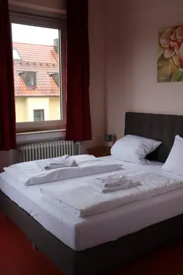 Ein Bett oder Betten in einem Zimmer der Unterkunft Restauration Schondorfer