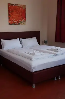 Ein Bett oder Betten in einem Zimmer der Unterkunft Restauration Schondorfer