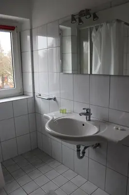 Ein Badezimmer in der Unterkunft Restauration Schondorfer