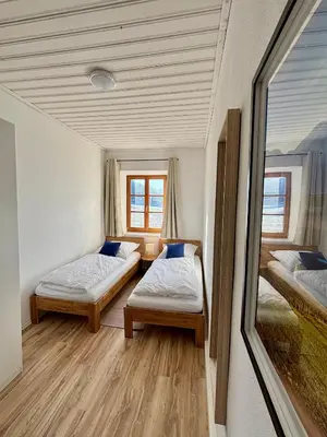Ein Bett oder Betten in einem Zimmer der Unterkunft Weidenhof Waldherr