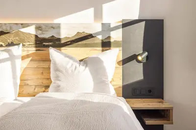 Ein Bett oder Betten in einem Zimmer der Unterkunft Alpen Lodge Samerberg