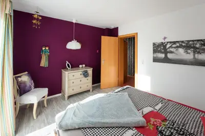 Ein Bett oder Betten in einem Zimmer der Unterkunft Ferienwohnung Lois *****