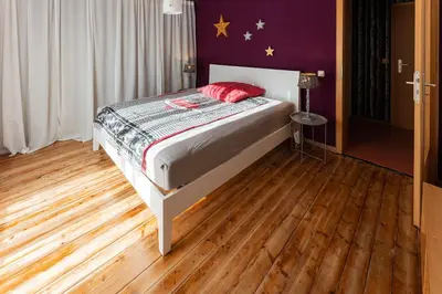 Ein Bett oder Betten in einem Zimmer der Unterkunft Ferienwohnung Lois *****