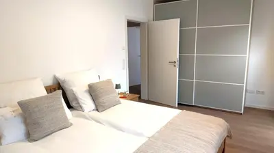 Ein Bett oder Betten in einem Zimmer der Unterkunft Chiemsee Apartment 17