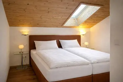 Ein Bett oder Betten in einem Zimmer der Unterkunft Ferienwohnung Kramerblick Marienplatz