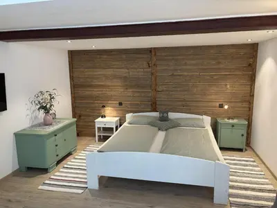 Ein Bett oder Betten in einem Zimmer der Unterkunft Ferienwohnung am Kienbach