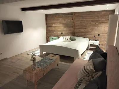 Ein Bett oder Betten in einem Zimmer der Unterkunft Ferienwohnung am Kienbach