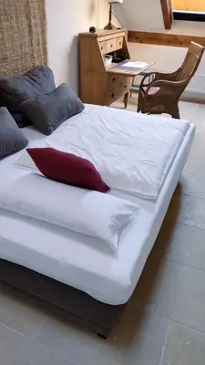 Ein Bett oder Betten in einem Zimmer der Unterkunft Ferienwohnung am alten Kino