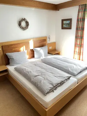 Ein Bett oder Betten in einem Zimmer der Unterkunft Das Alpenglühn Hotel & Restaurant