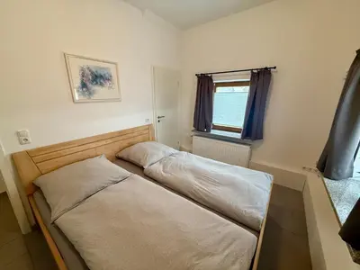 Ein Bett oder Betten in einem Zimmer der Unterkunft FeWo Gretl Stauden