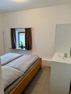 Ein Bett oder Betten in einem Zimmer der Unterkunft FeWo Gretl Stauden